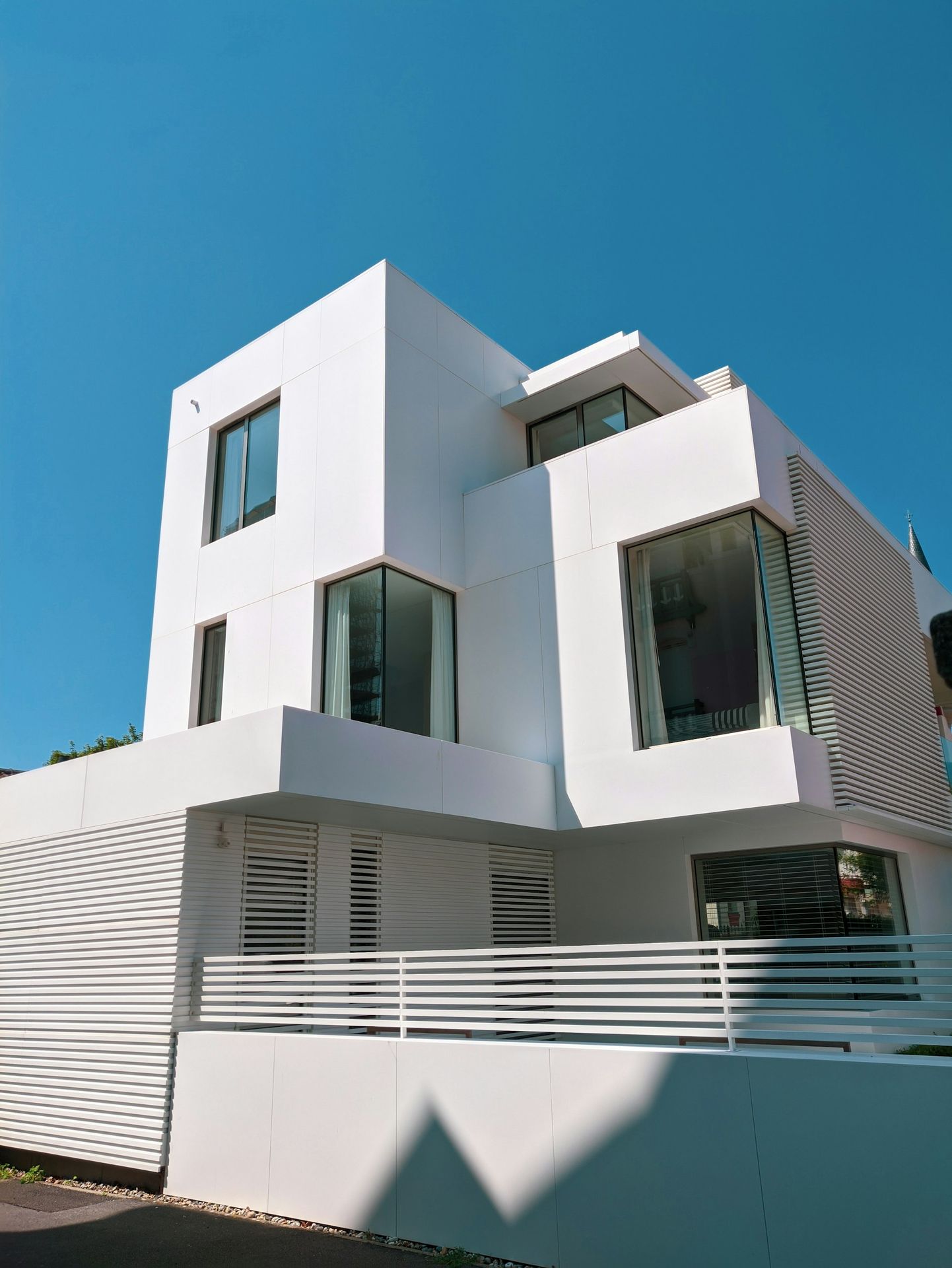 white concrete building under blue sky during daytime